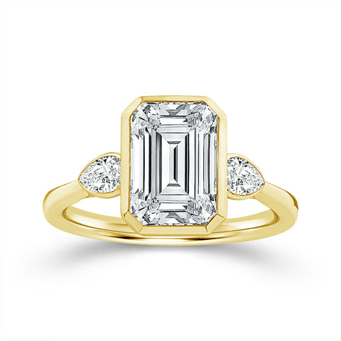 Bezel Set Emerald and Pear Lab Grown Diamond Engagement Ring in Yellow Gold (3 Ct Center)