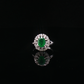 Oval Emerald and Diamond Halo Cocktail Ring in White Gold