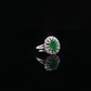 Oval Emerald and Diamond Halo Cocktail Ring in White Gold