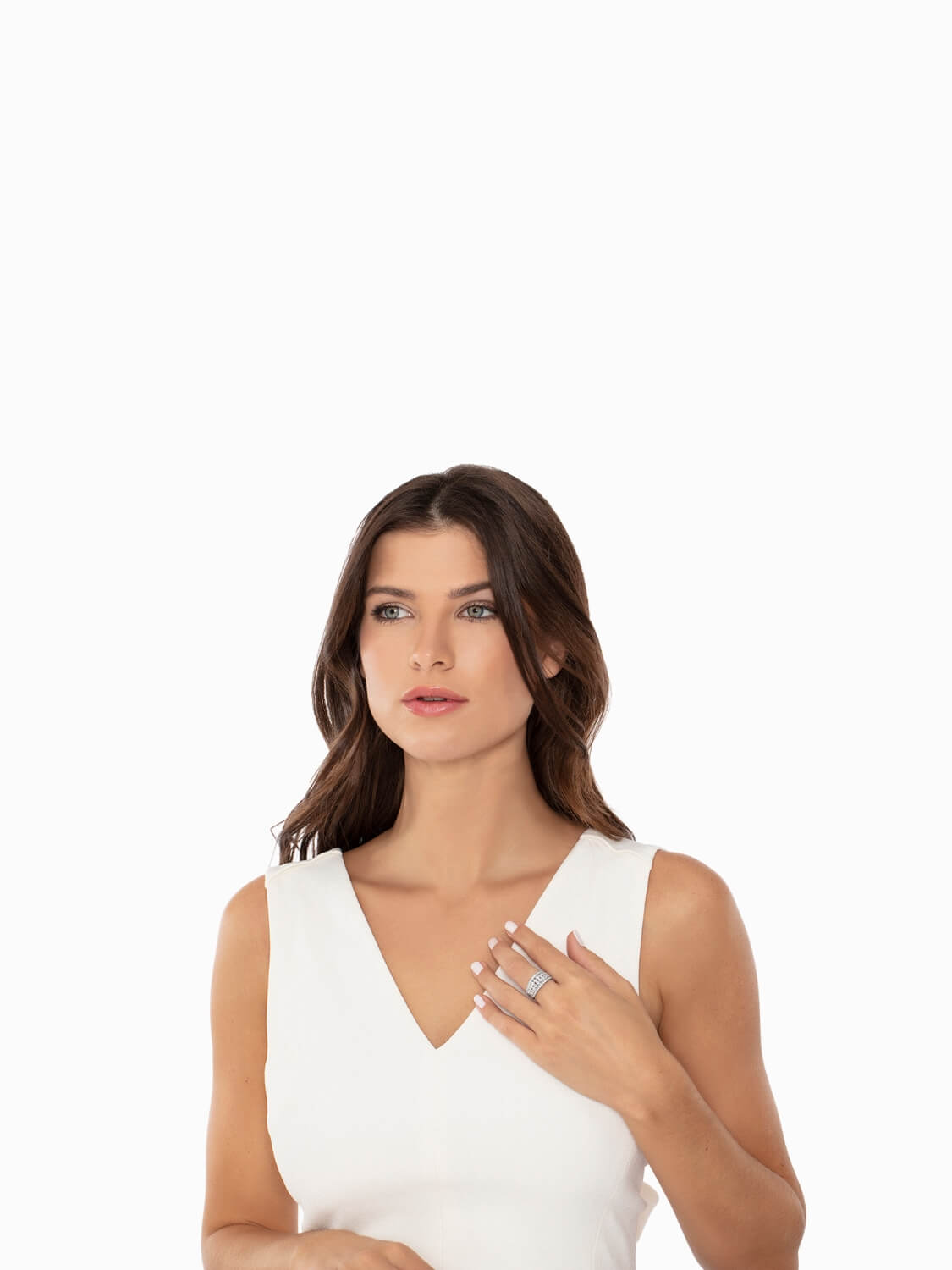 Woman wearing a white sleeveless top on a plain background