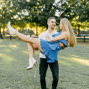 man holding woman after proposing
