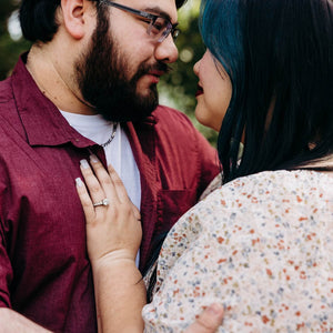 Couple getting engaged with diamond ring