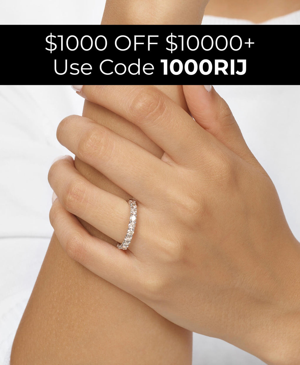 Hand wearing a diamond ring with promotional text overlay on a white background