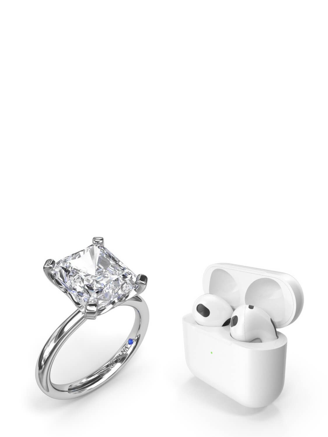 Diamond ring and white wireless earbuds in a case on a white background