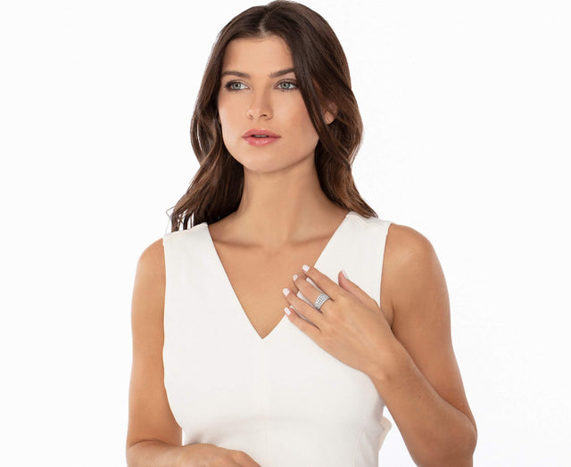 woman wearing white shirt and diamond ring