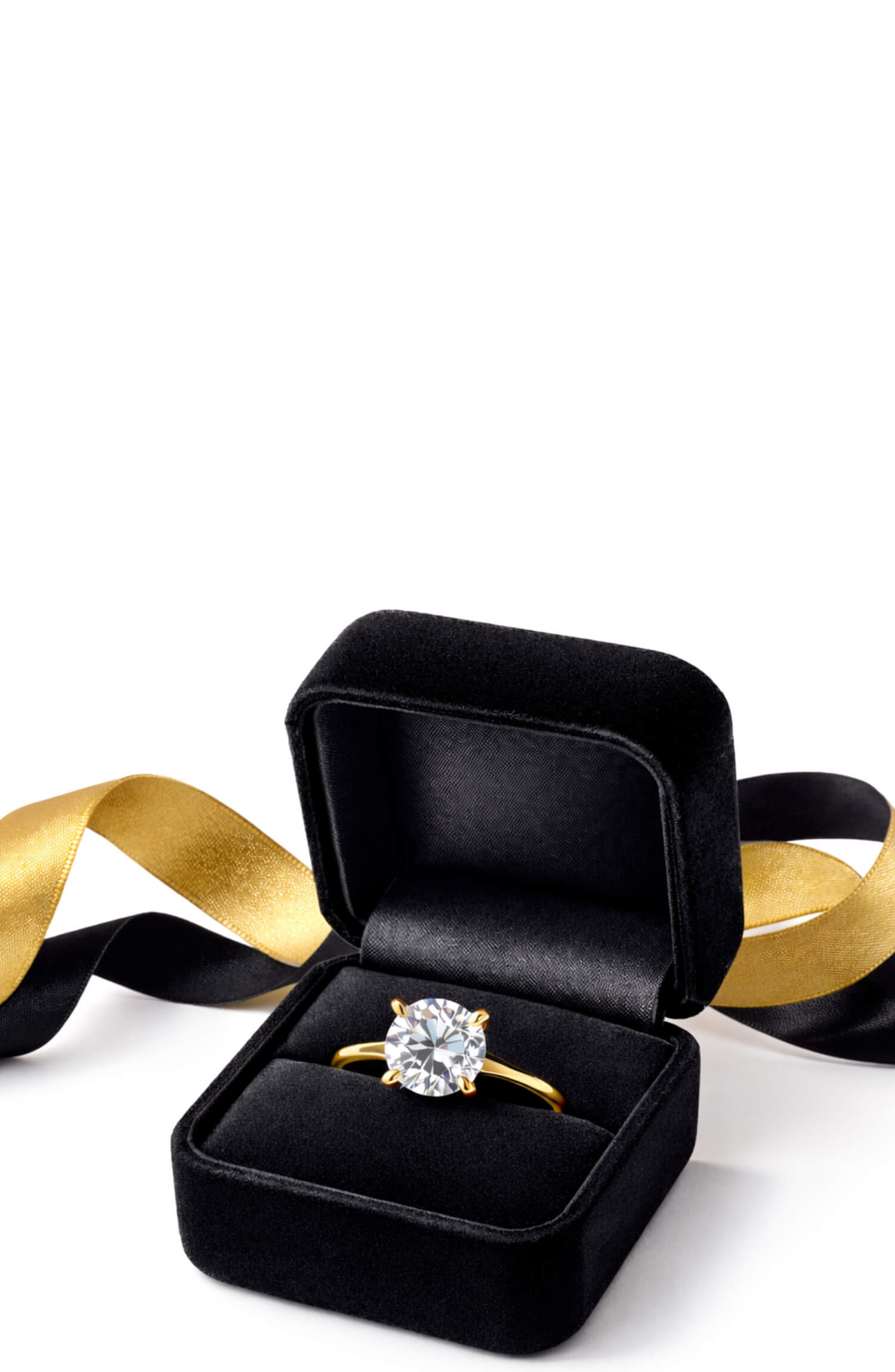 Diamond ring in a black box with a gold ribbon on a white background