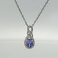 Oval Tanzanite and Diamond Halo Pendant Necklace in Sterling Silver